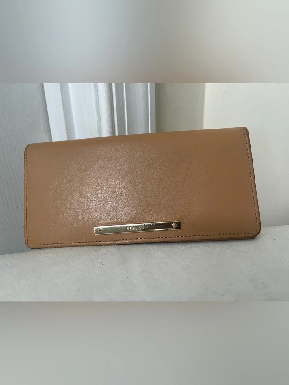 Brahmin tan leather continental wallet with gold-tone logo